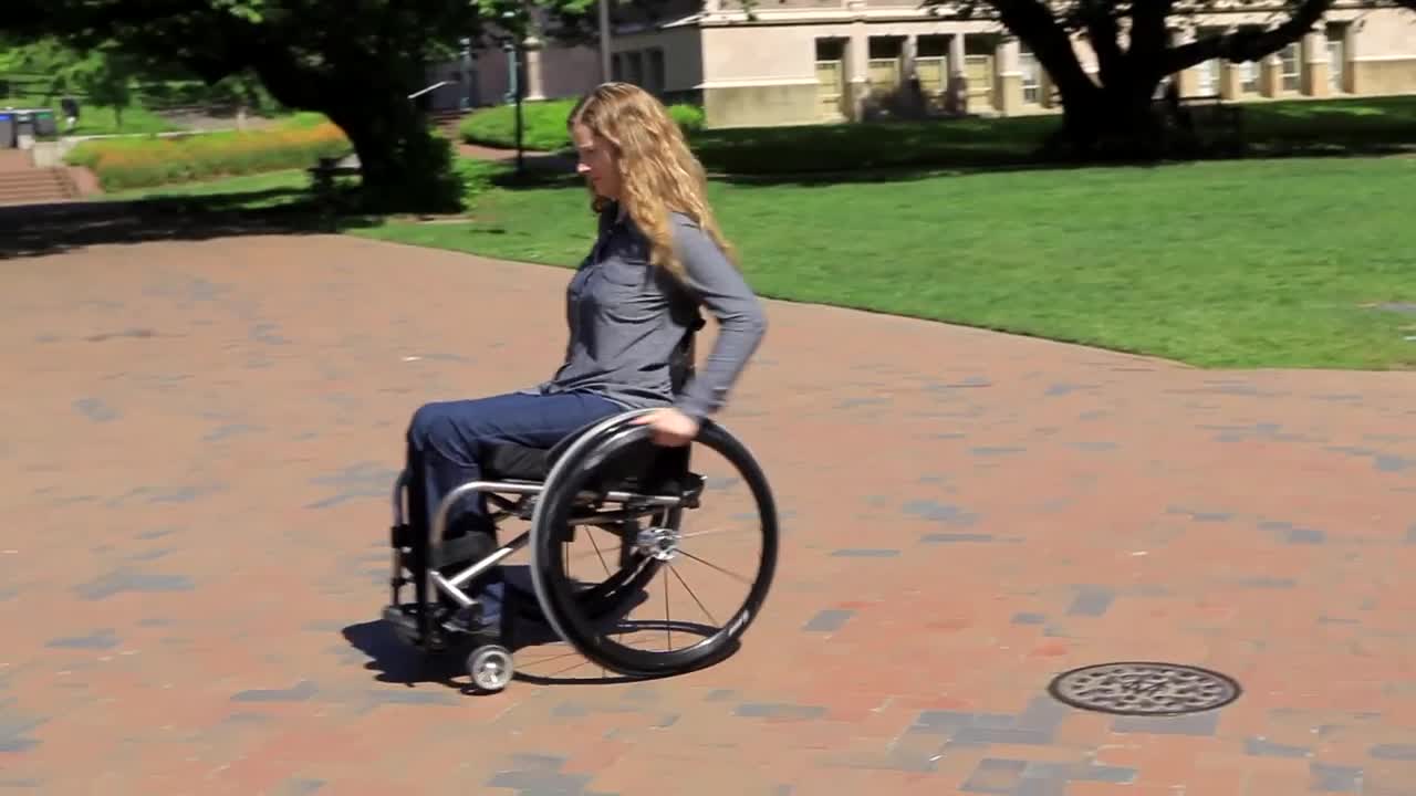 Still shot of video of woman in a wheelchair